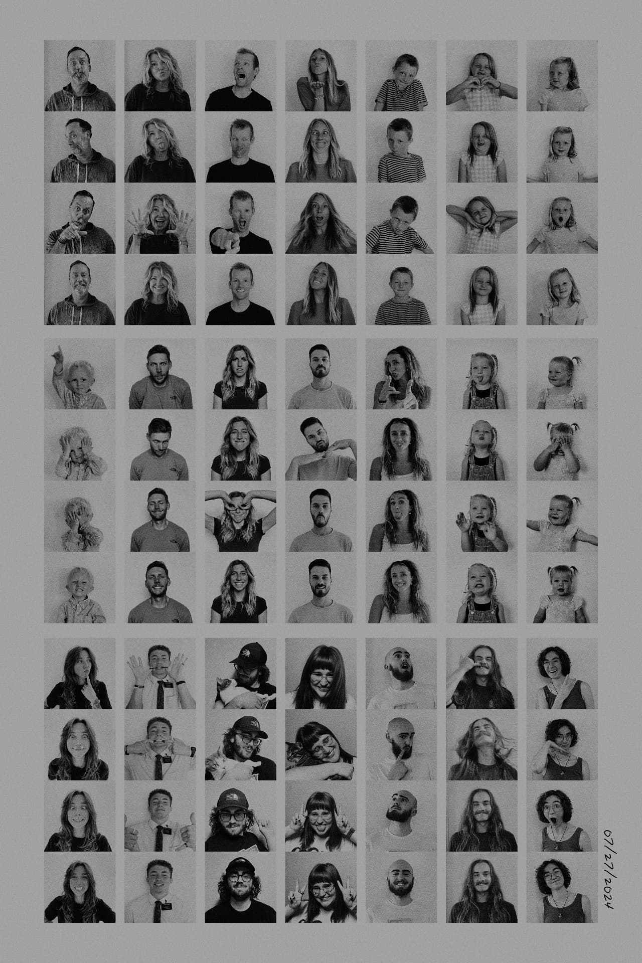 A wall of black and white family portraits
